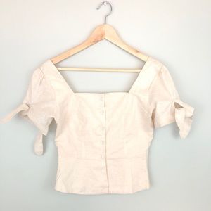 Cream peplum tie sleeve top
